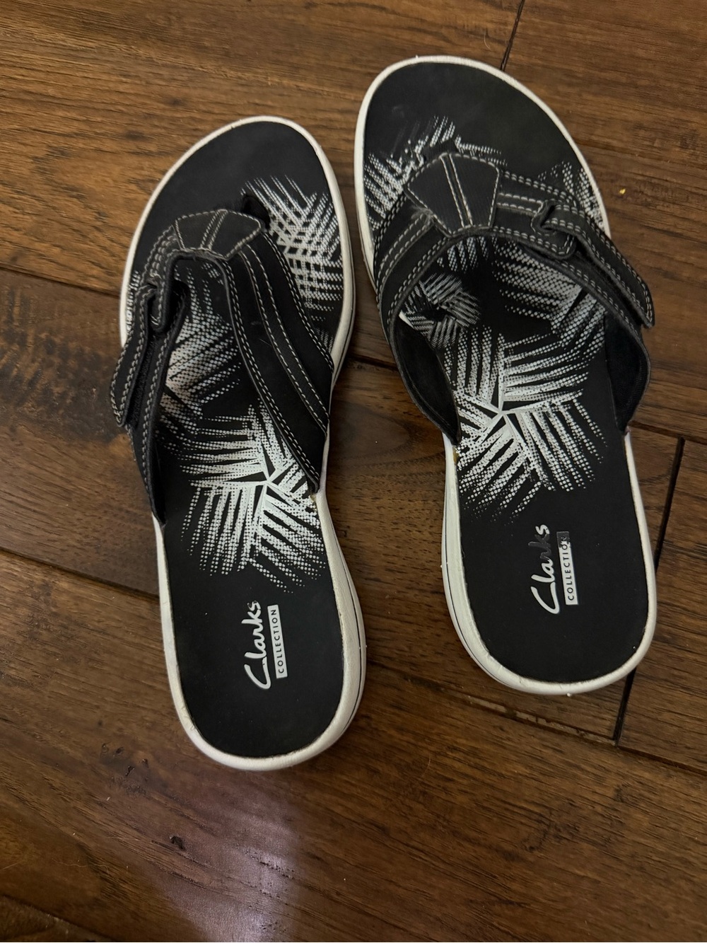 Clarks Black Slide Sandals with White Graphic Footbed